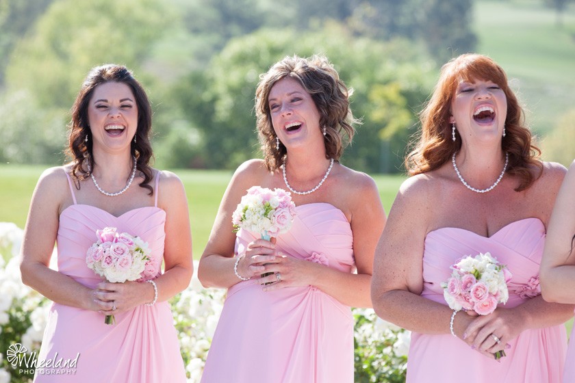 Pink bridesmaids laughing